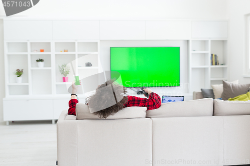 Image of young man in bathrobe enjoying free time