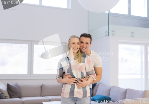 Image of couple hugging in their new home