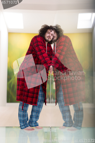 Image of portrait of young man in bathrobe