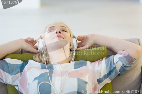 Image of girl enjoying music through headphones