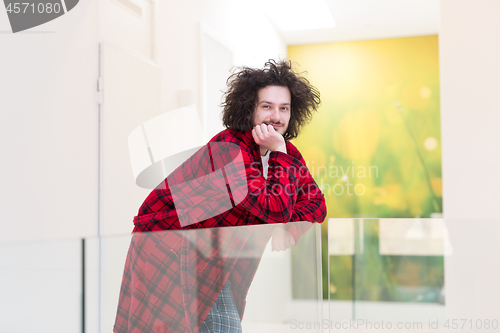 Image of portrait of young man in bathrobe