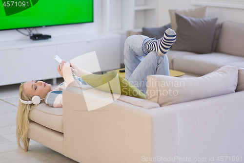 Image of girl enjoying music through headphones