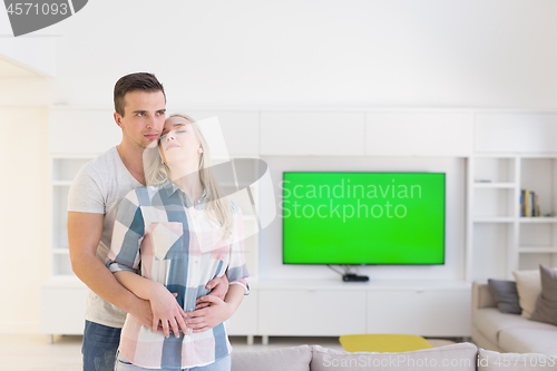 Image of couple hugging in their new home