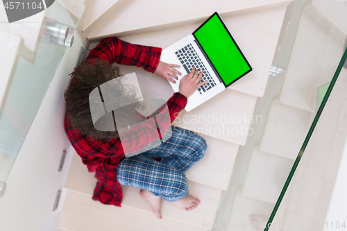 Image of freelancer in bathrobe working from home