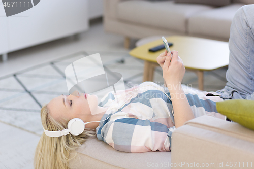 Image of girl enjoying music through headphones