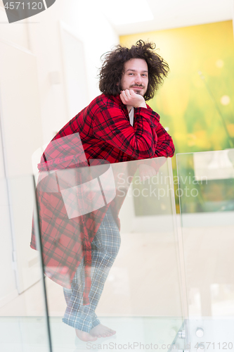 Image of portrait of young man in bathrobe