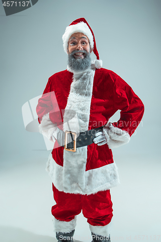 Image of Funny guy in christmas hat. New Year Holiday. Christmas, x-mas, winter, gifts concept.