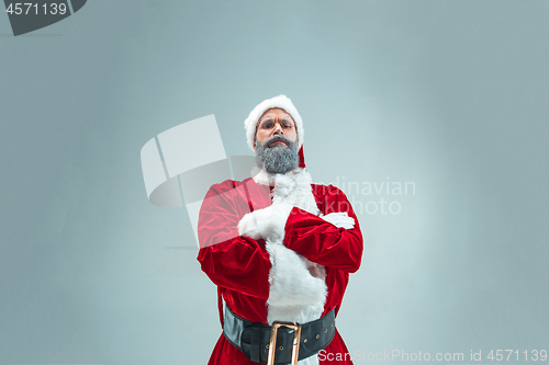 Image of Funny guy in christmas hat. New Year Holiday. Christmas, x-mas, winter, gifts concept.