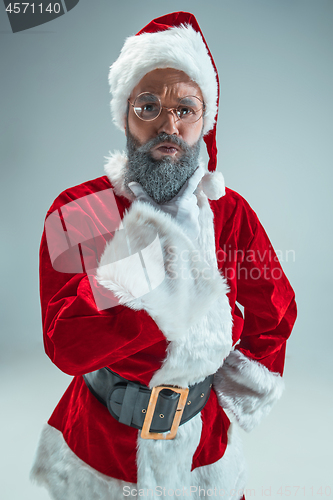 Image of Funny guy in christmas hat. New Year Holiday. Christmas, x-mas, winter, gifts concept.