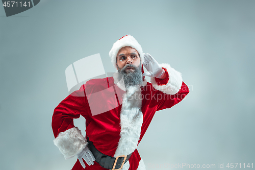 Image of Funny guy in christmas hat. New Year Holiday. Christmas, x-mas, winter, gifts concept.