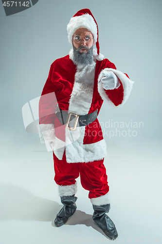 Image of Funny guy in christmas hat. New Year Holiday. Christmas, x-mas, winter, gifts concept.