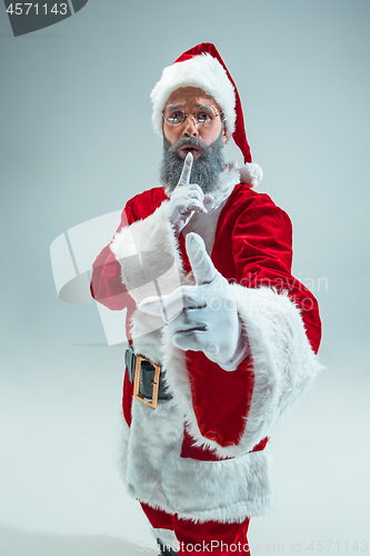 Image of Funny guy in christmas hat. New Year Holiday. Christmas, x-mas, winter, gifts concept.