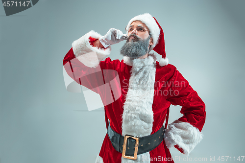 Image of Funny guy in christmas hat. New Year Holiday. Christmas, x-mas, winter, gifts concept.