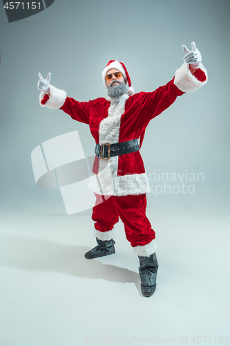 Image of Funny guy in christmas hat. New Year Holiday. Christmas, x-mas, winter, gifts concept.