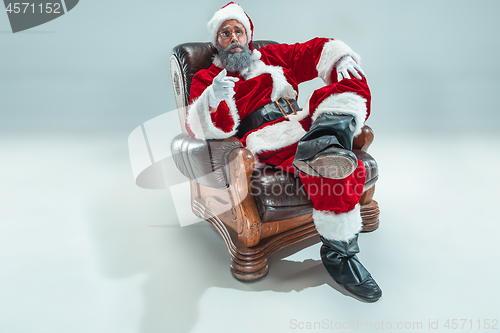 Image of Funny guy in christmas hat. New Year Holiday. Christmas, x-mas, winter, gifts concept.