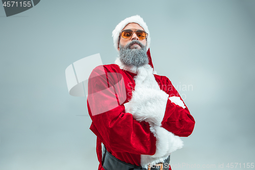 Image of Funny guy in christmas hat. New Year Holiday. Christmas, x-mas, winter, gifts concept.