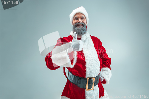 Image of Funny guy in christmas hat. New Year Holiday. Christmas, x-mas, winter, gifts concept.