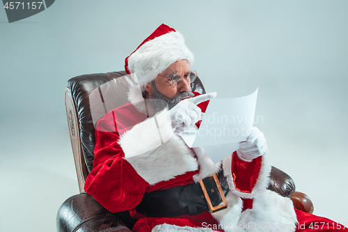 Image of Funny guy in christmas hat. New Year Holiday. Christmas, x-mas, winter, gifts concept.