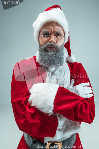 Image of Funny guy in christmas hat. New Year Holiday. Christmas, x-mas, winter, gifts concept.