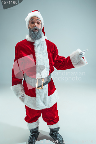 Image of Funny guy in christmas hat. New Year Holiday. Christmas, x-mas, winter, gifts concept.