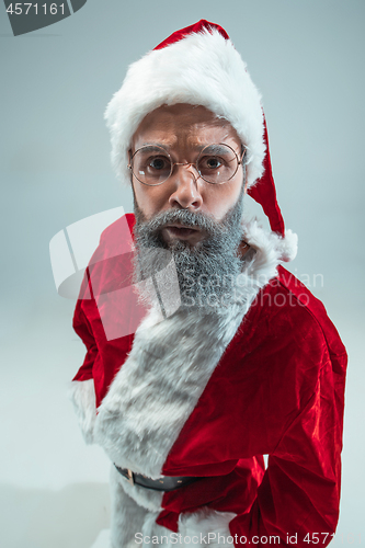 Image of Funny guy in christmas hat. New Year Holiday. Christmas, x-mas, winter, gifts concept.