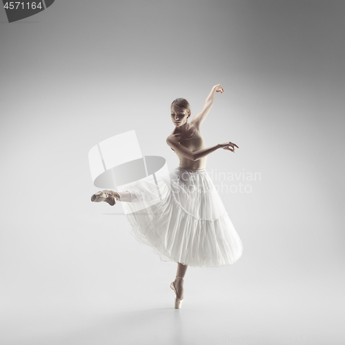 Image of Ballerina. Young graceful female ballet dancer dancing at studio. Beauty of classic ballet.