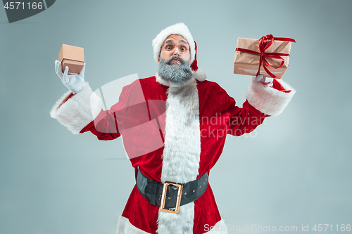 Image of Funny guy in christmas hat. New Year Holiday. Christmas, x-mas, winter, gifts concept.