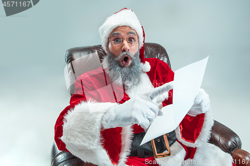 Image of Funny guy in christmas hat. New Year Holiday. Christmas, x-mas, winter, gifts concept.