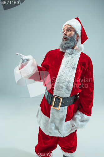 Image of Funny guy in christmas hat. New Year Holiday. Christmas, x-mas, winter, gifts concept.