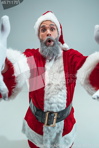 Image of Funny guy in christmas hat. New Year Holiday. Christmas, x-mas, winter, gifts concept.