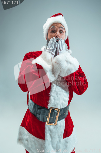 Image of Funny guy in christmas hat. New Year Holiday. Christmas, x-mas, winter, gifts concept.