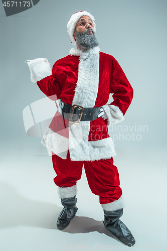 Image of Funny guy in christmas hat. New Year Holiday. Christmas, x-mas, winter, gifts concept.