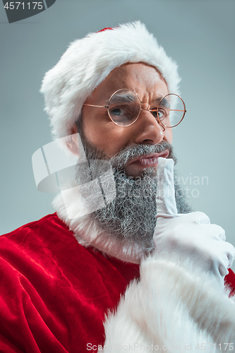 Image of Funny guy in christmas hat. New Year Holiday. Christmas, x-mas, winter, gifts concept.