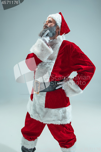 Image of Funny guy in christmas hat. New Year Holiday. Christmas, x-mas, winter, gifts concept.