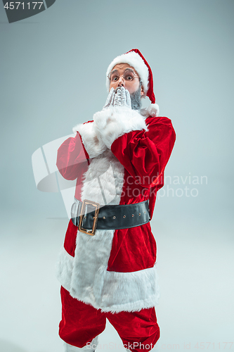 Image of Funny guy in christmas hat. New Year Holiday. Christmas, x-mas, winter, gifts concept.