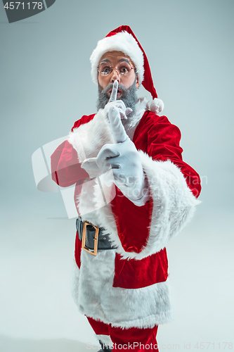 Image of Funny guy in christmas hat. New Year Holiday. Christmas, x-mas, winter, gifts concept.