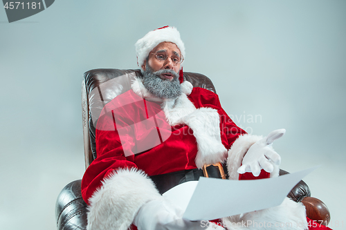 Image of Funny guy in christmas hat. New Year Holiday. Christmas, x-mas, winter, gifts concept.