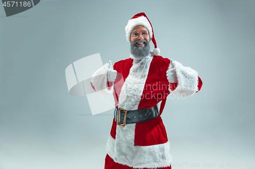 Image of Funny guy in christmas hat. New Year Holiday. Christmas, x-mas, winter, gifts concept.