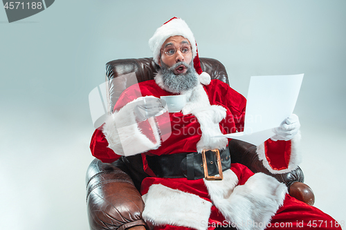 Image of Funny guy in christmas hat. New Year Holiday. Christmas, x-mas, winter, gifts concept.