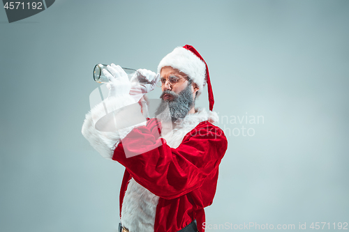 Image of Funny guy in christmas hat. New Year Holiday. Christmas, x-mas, winter, gifts concept.