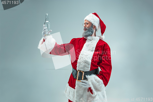 Image of Funny guy in christmas hat. New Year Holiday. Christmas, x-mas, winter, gifts concept.