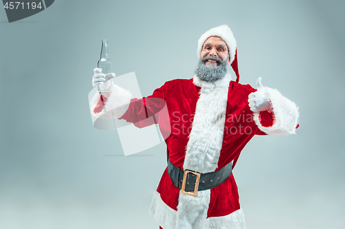 Image of Funny guy in christmas hat. New Year Holiday. Christmas, x-mas, winter, gifts concept.