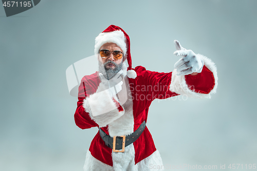 Image of Funny guy in christmas hat. New Year Holiday. Christmas, x-mas, winter, gifts concept.