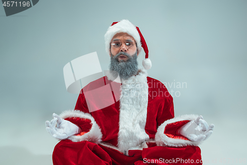 Image of Funny guy in christmas hat. New Year Holiday. Christmas, x-mas, winter, gifts concept.