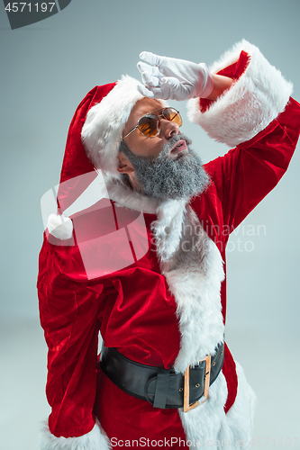 Image of Funny guy in christmas hat. New Year Holiday. Christmas, x-mas, winter, gifts concept.