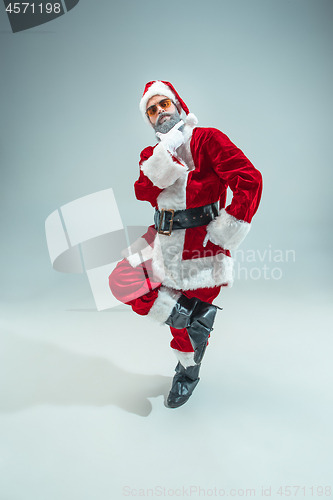 Image of Funny guy in christmas hat. New Year Holiday. Christmas, x-mas, winter, gifts concept.