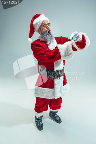 Image of Funny guy in christmas hat. New Year Holiday. Christmas, x-mas, winter, gifts concept.