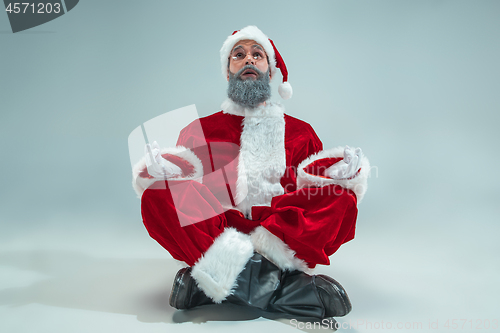 Image of Funny guy in christmas hat. New Year Holiday. Christmas, x-mas, winter, gifts concept.