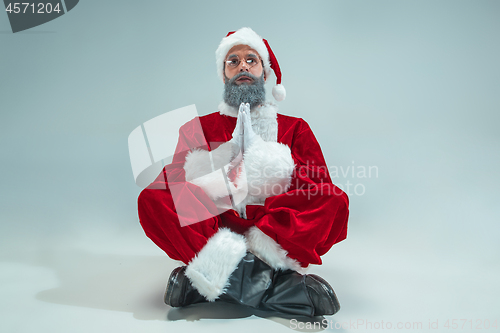 Image of Funny guy in christmas hat. New Year Holiday. Christmas, x-mas, winter, gifts concept.