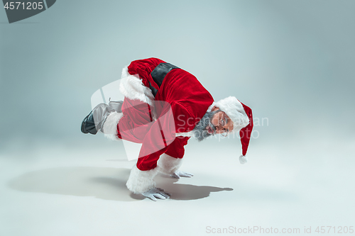 Image of Funny guy in christmas hat. New Year Holiday. Christmas, x-mas, winter, gifts concept.